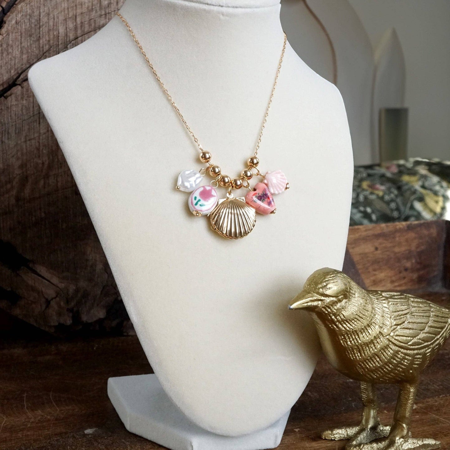 Chinosery multi charm and shell Lockett spring necklace pink and gold