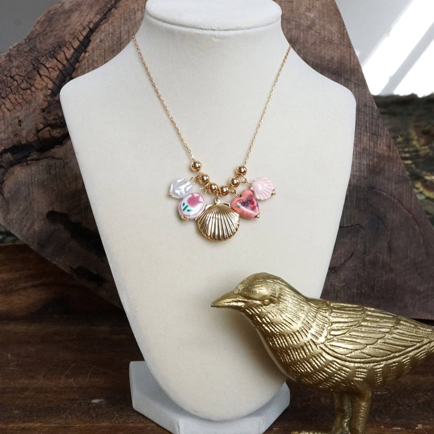 Chinosery multi charm and shell Lockett spring necklace pink and gold