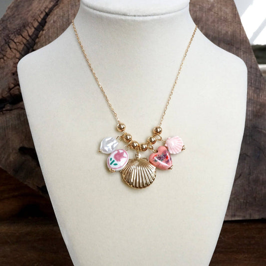 Chinosery multi charm and shell Lockett spring necklace pink and gold